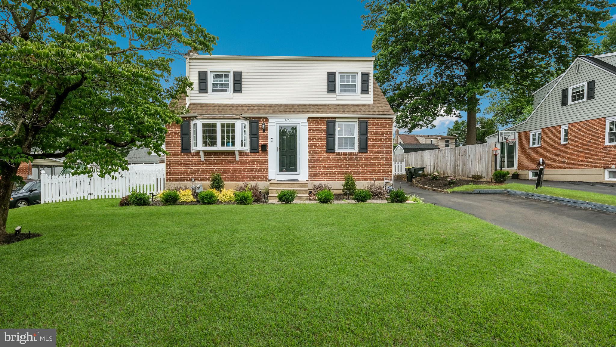 626 Topsfield Road Hatboro, PA 19040 - Photo 1 of 29 a front view of a house with a garden and yard