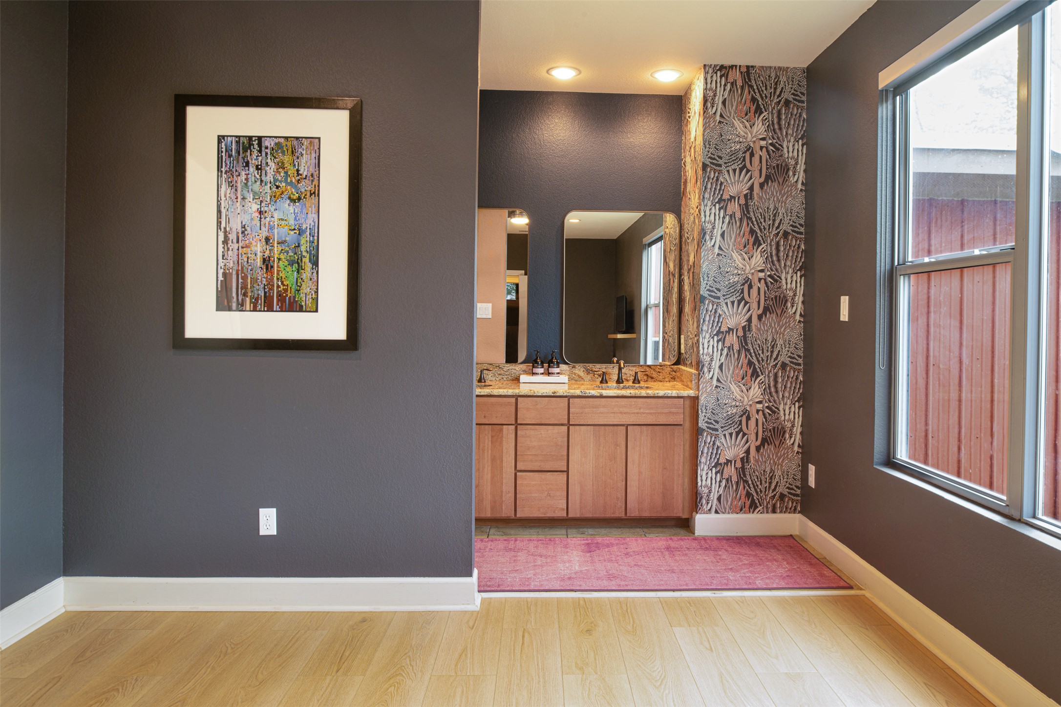 2302 East 9th Street Austin, TX 78702 - Photo 18 of 31 A well-appointed bathroom area features double vanities and an abundance of natural light.