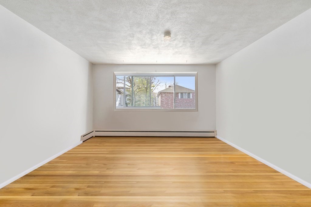 20 Radcliffe Road, Unit 304 Boston, MA 02134 - Photo 16 of 24 an empty room with window