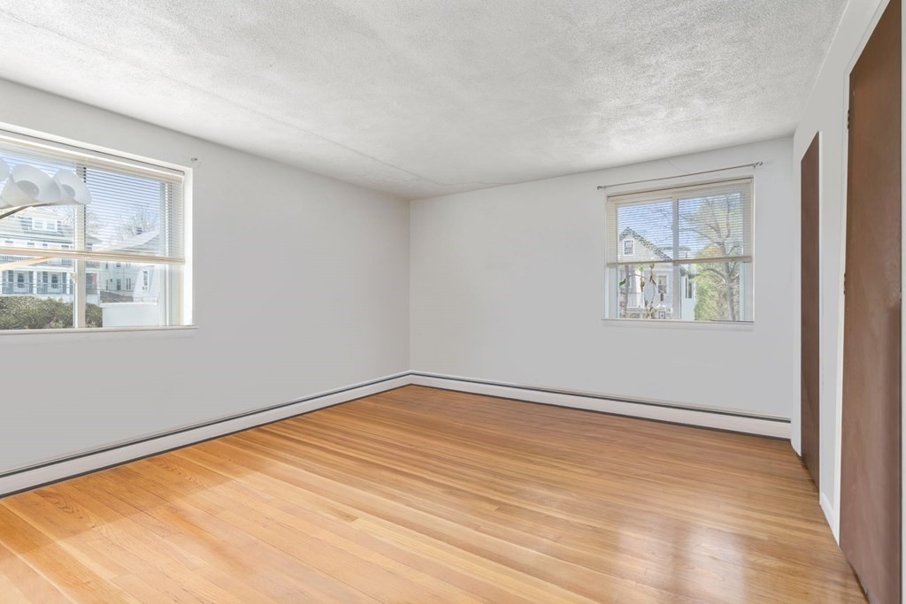 20 Radcliffe Road, Unit 304 Boston, MA 02134 - Photo 17 of 24 wooden floor in an empty room with a window