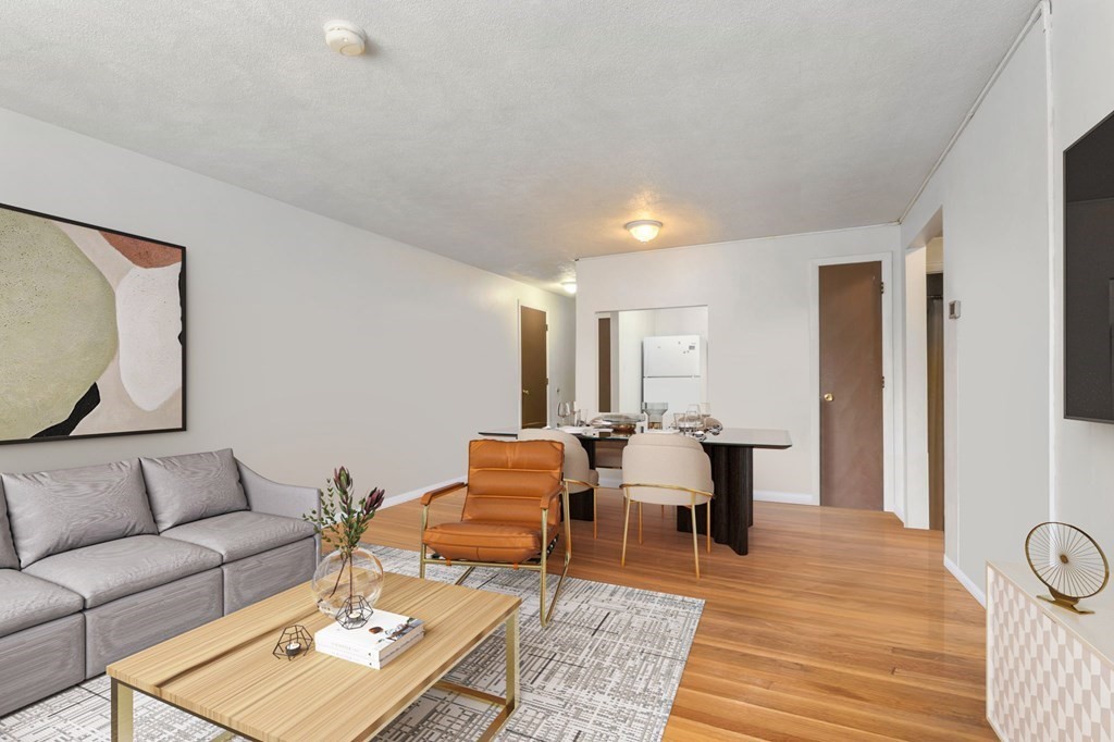 20 Radcliffe Road, Unit 304 Boston, MA 02134 - Photo 2 of 24 a living room with furniture and wooden floor