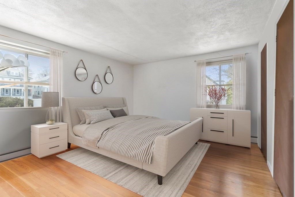 20 Radcliffe Road, Unit 304 Boston, MA 02134 - Photo 3 of 24 a bedroom with a bed and a window