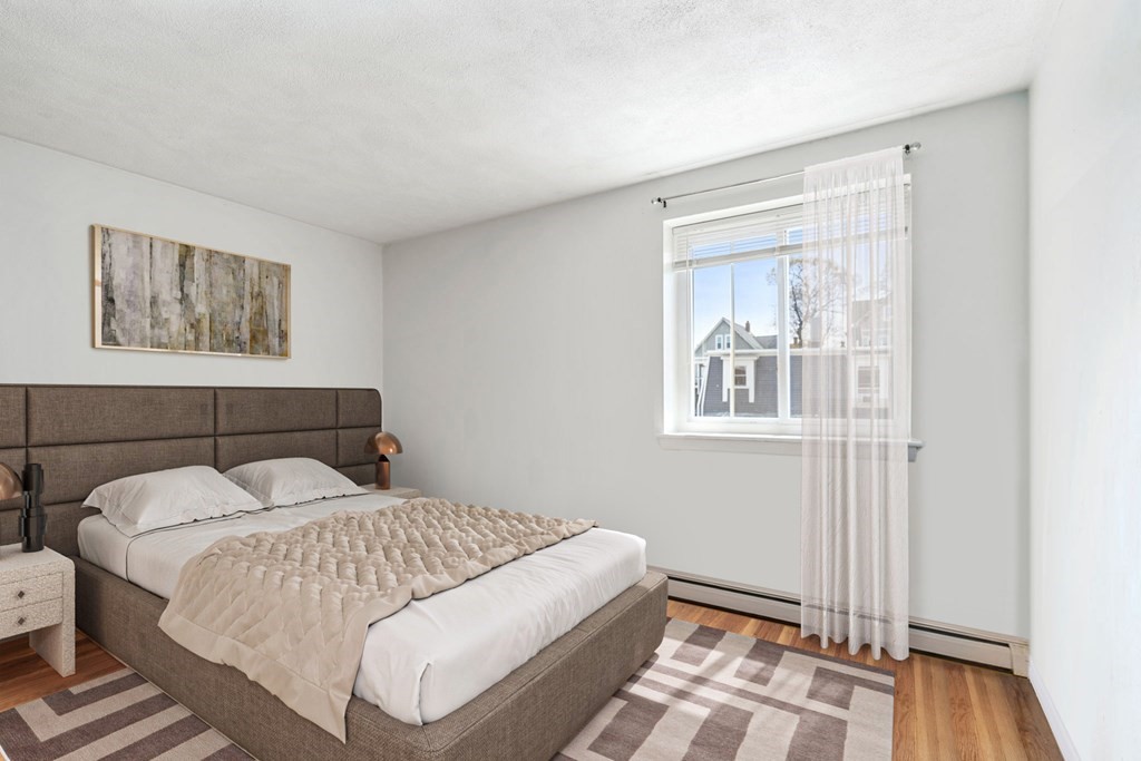 20 Radcliffe Road, Unit 304 Boston, MA 02134 - Photo 4 of 24 a bedroom with a bed and a window