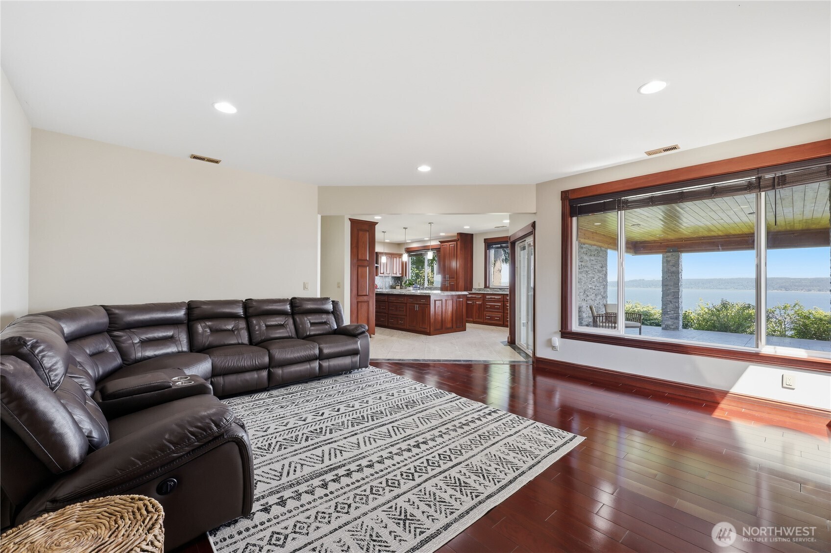 1411 Thorndyke Road Port Ludlow, WA 98365 - Photo 19 of 40 a living room with furniture and a large window
