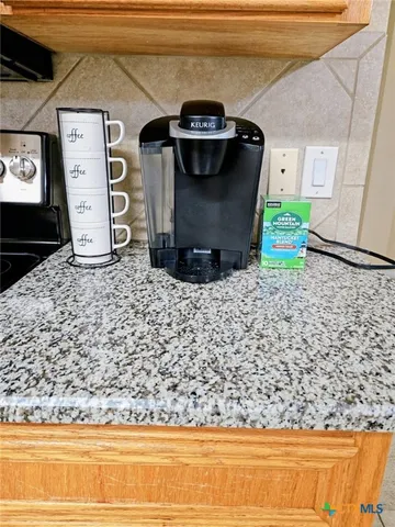 a closeup of a sink and a stove