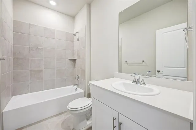 a bathroom with a sink toilet and bathtub