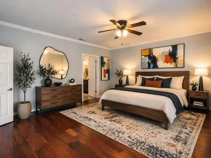 a bedroom with a bed and a dresser