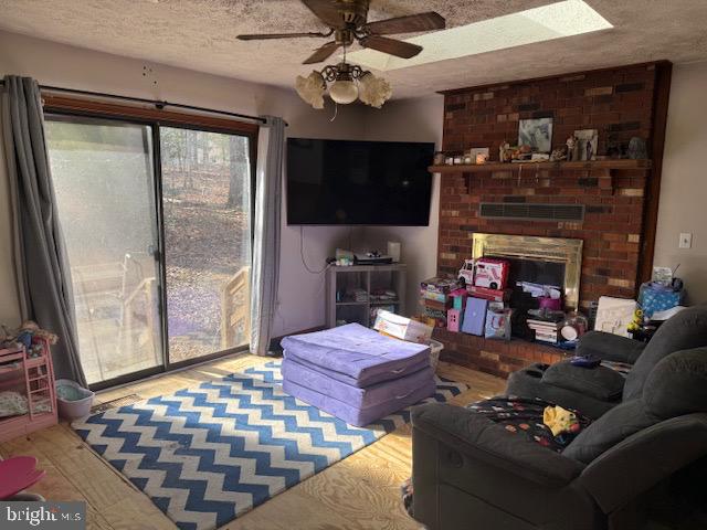 128 Jefferson Avenue Locust Grove, VA 22508 - Photo 3 of 9 a living room with furniture a flat screen tv and a fireplace