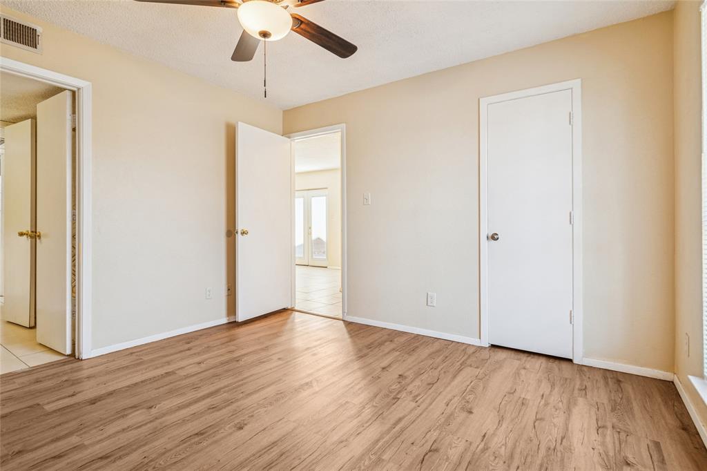 2111 East Belt Line Road, Unit 132C Richardson, TX 75081 - Photo 9 of 15 a view of an empty room with wooden floor