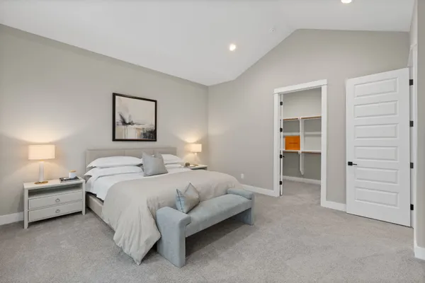 a bathroom with a double vanity sink a mirror and a shower