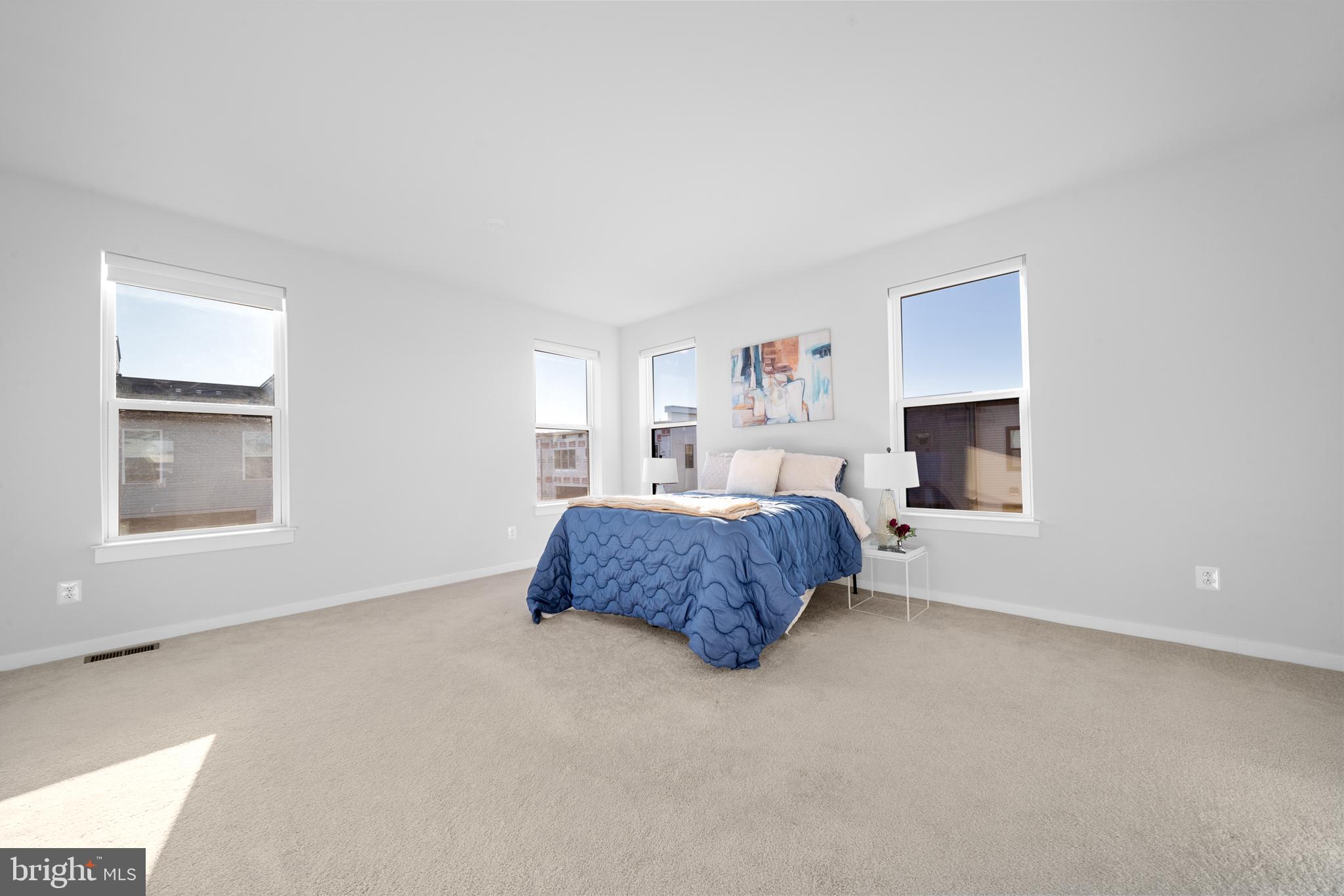 43730 Transit Square Ashburn, VA 20147 - Photo 25 of 48 a bedroom with a bed lamp and a window