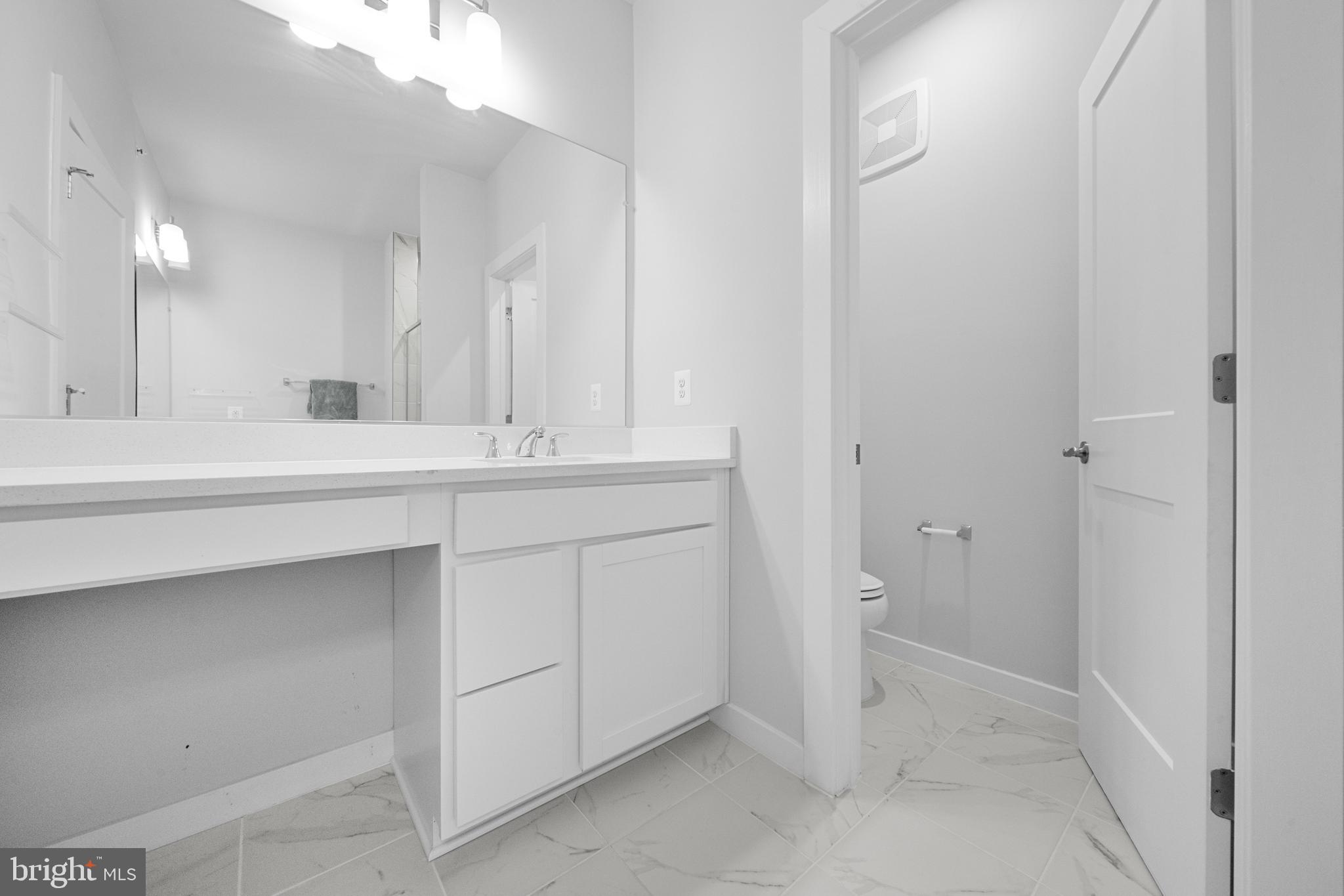 43730 Transit Square Ashburn, VA 20147 - Photo 29 of 48 a bathroom with a sink and a mirror