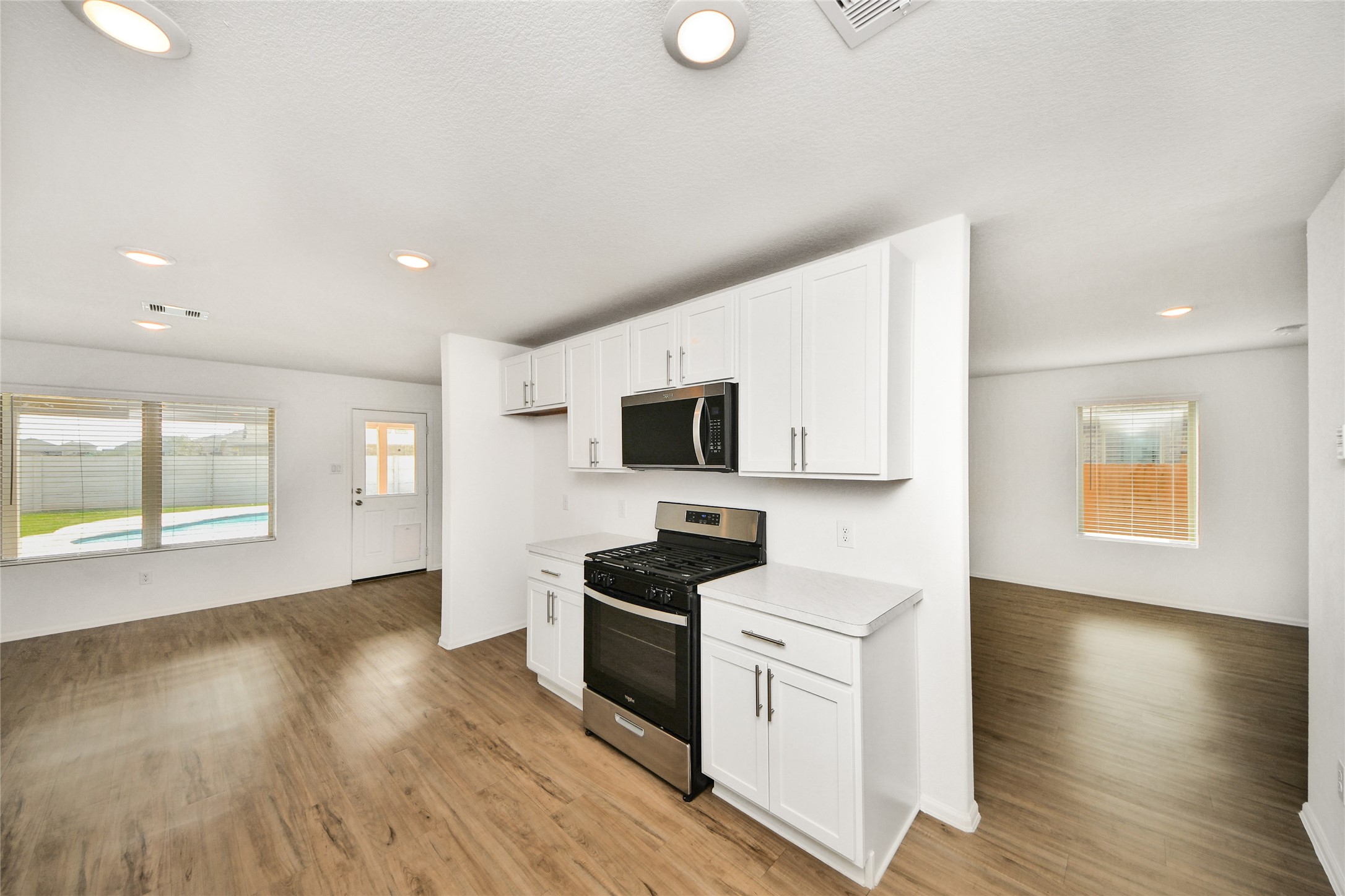 5011 Stratton Lane Rosharon, TX 77583 - Photo 13 of 38 Modern appliances complement the kitchen’s practical layout.