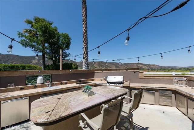 an aerial view of a house with yard