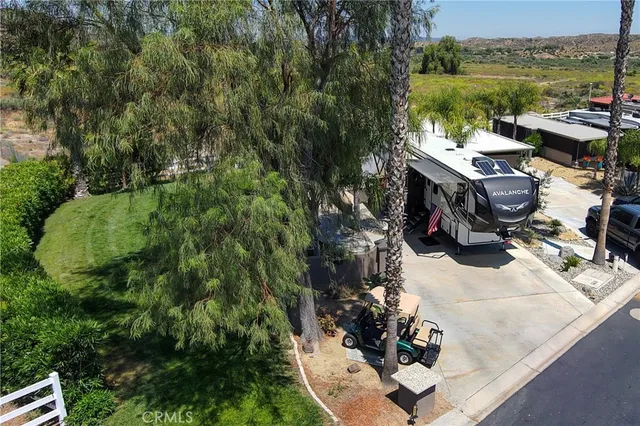a kitchen with a stove and a white wooden cabinets
