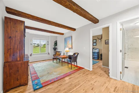 a bedroom with furniture and a window