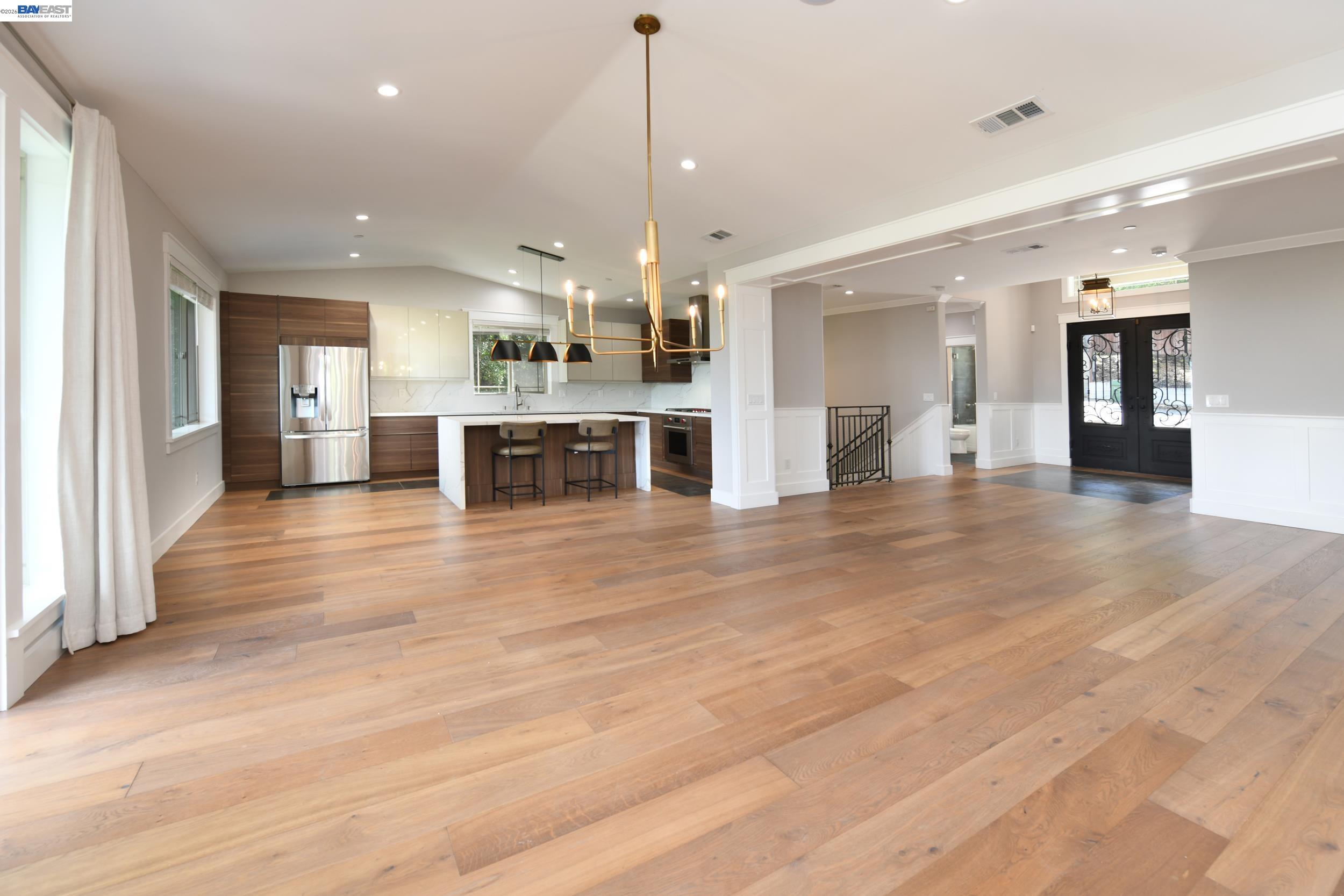 1516 Pleasant Hill Road Lafayette, CA 94549 - Photo 4 of 38 an open kitchen with a refrigerator and a stove top oven