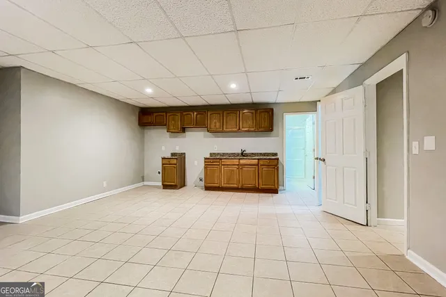 a view of an empty room with a fireplace