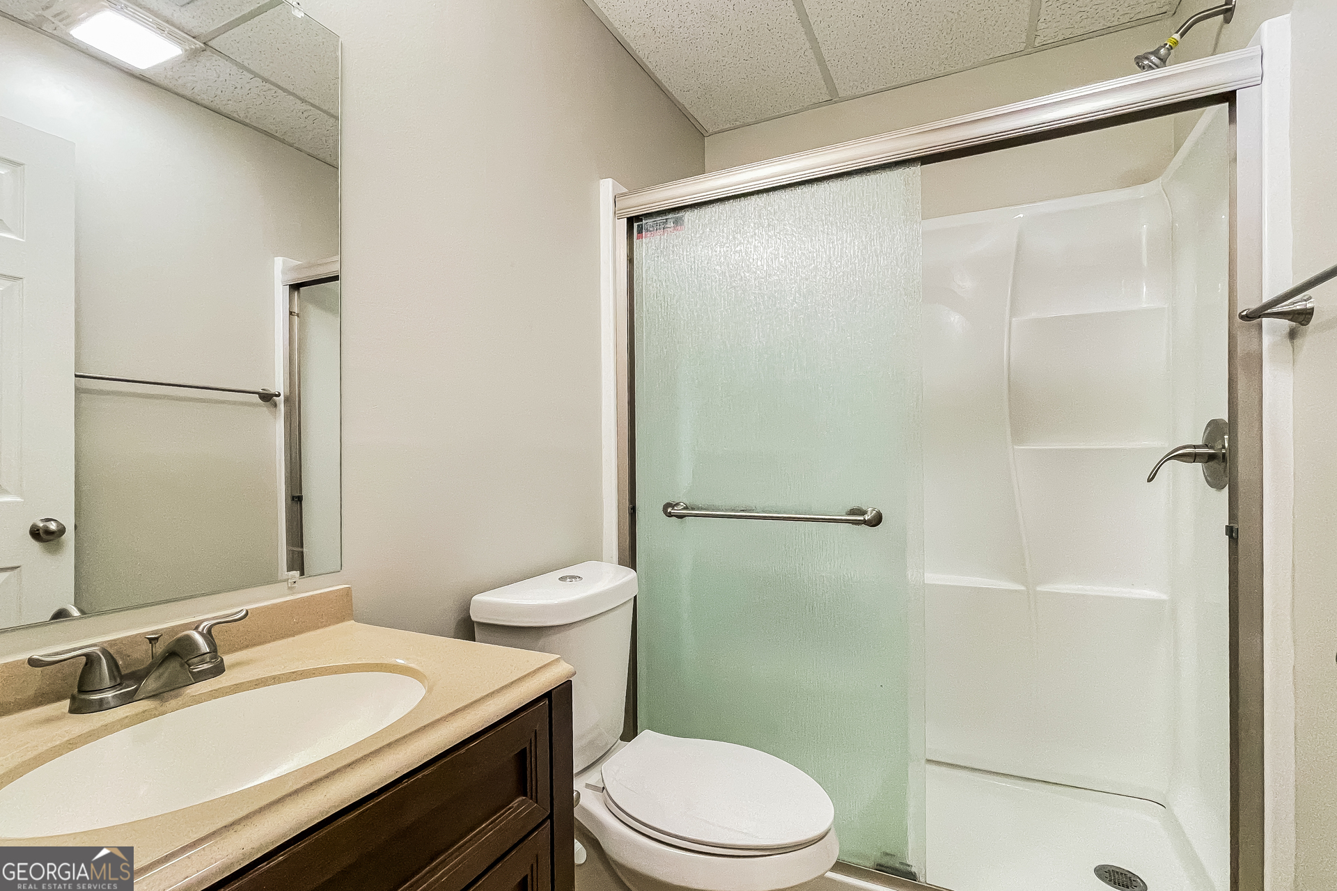 107 Johnny Lane Dallas, GA 30132 - Photo 10 of 17 a bathroom with a granite countertop sink toilet and shower