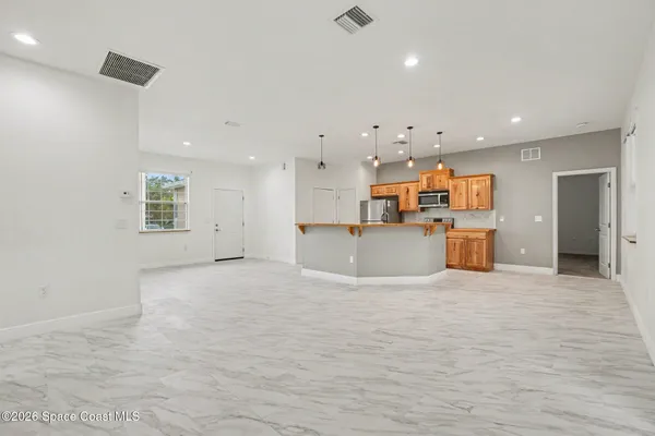 a view of a kitchen with a sink