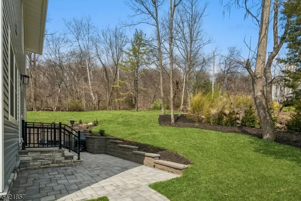 a view of outdoor space with patio bathtub and trees