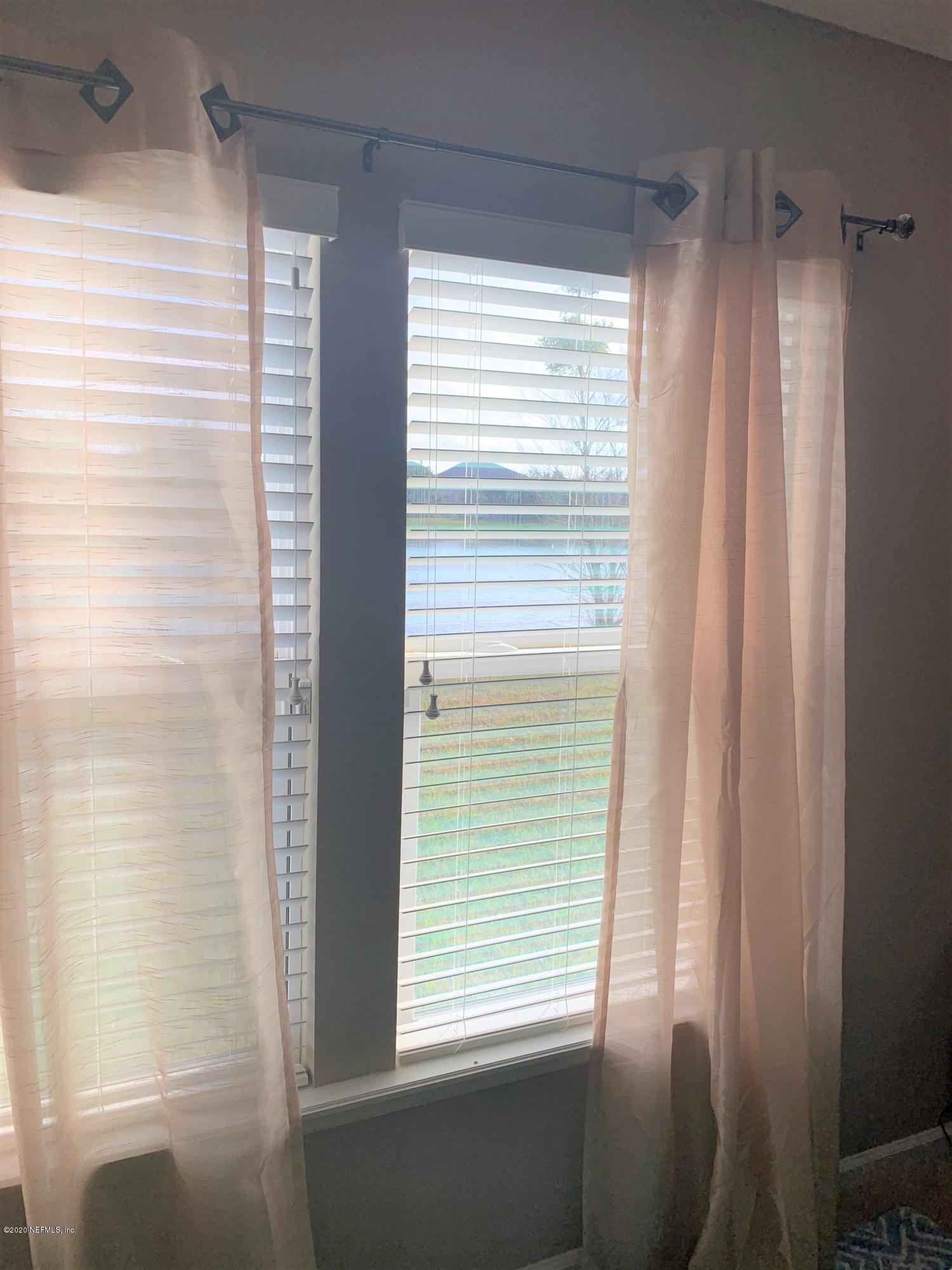 16007 Hutton Lane Jacksonville, FL 32218 - Photo 13 of 29 a view of a window and a bathroom