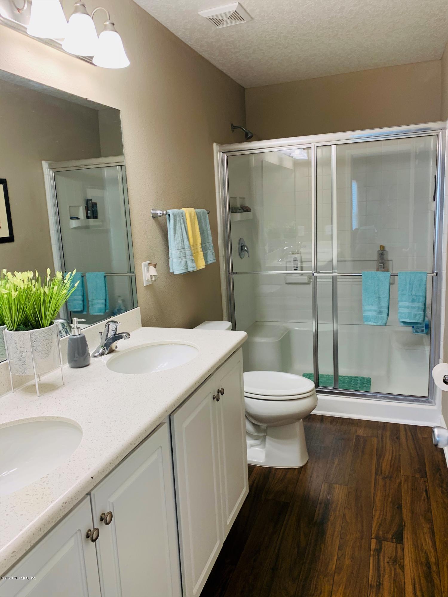 16007 Hutton Lane Jacksonville, FL 32218 - Photo 14 of 29 a bathroom with a sink and a mirror
