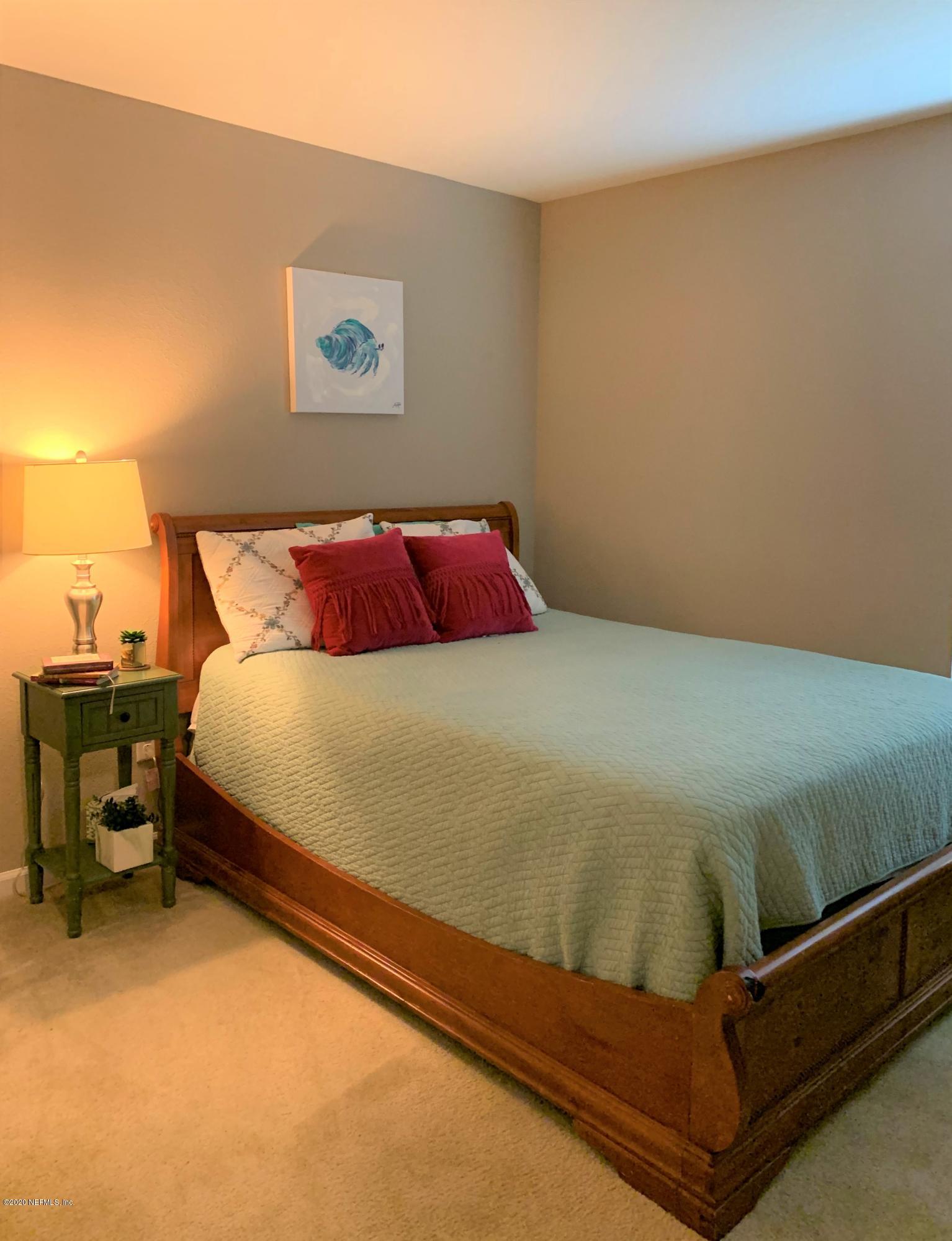 16007 Hutton Lane Jacksonville, FL 32218 - Photo 17 of 29 a bedroom with a bed and window