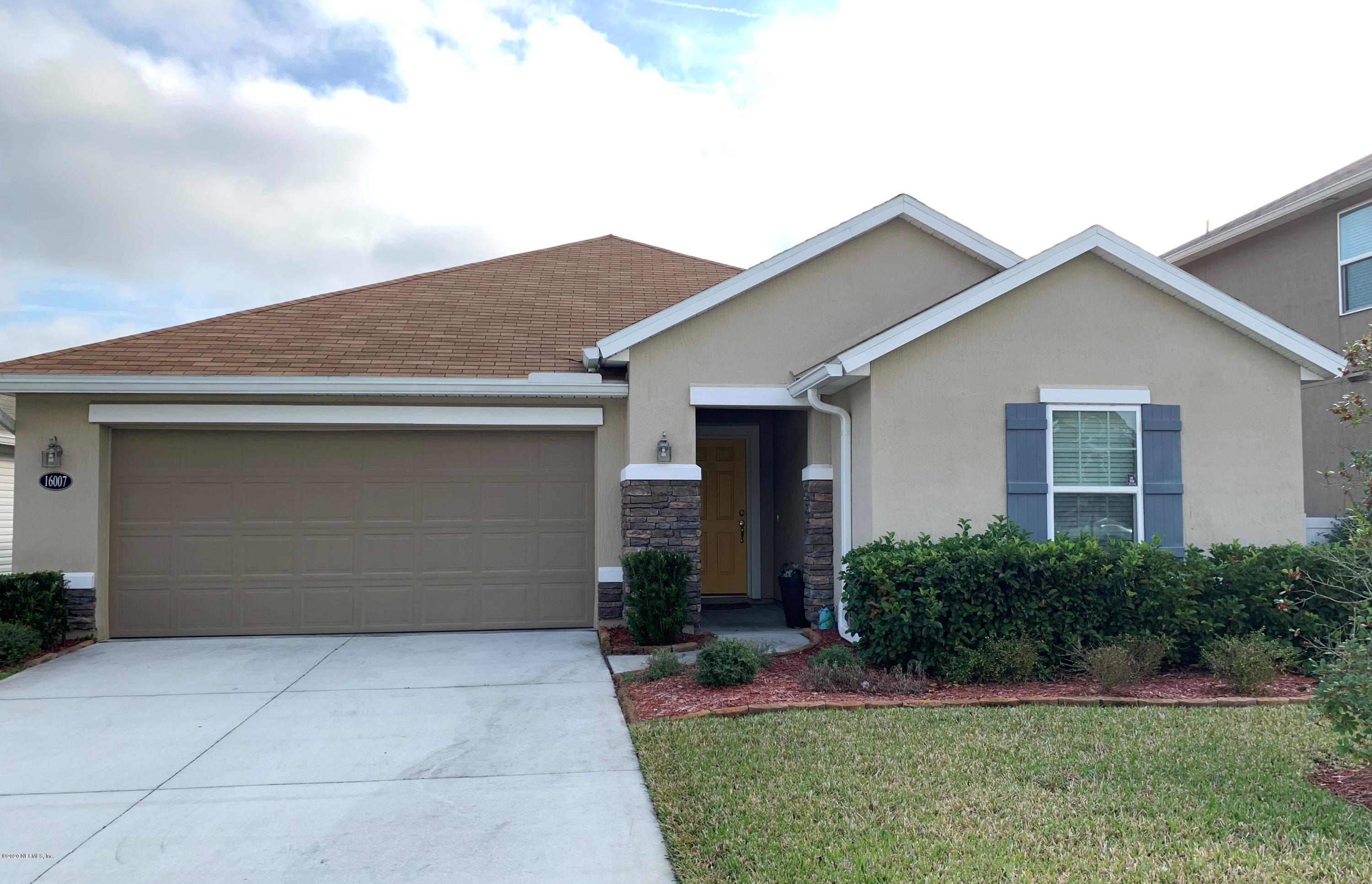 16007 Hutton Lane Jacksonville, FL 32218 - Photo 2 of 29 a front view of house with yard and trees