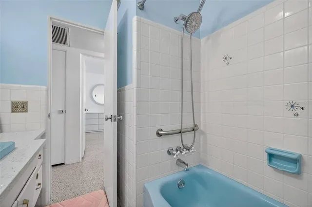 a view of a livingroom with furniture and a large window