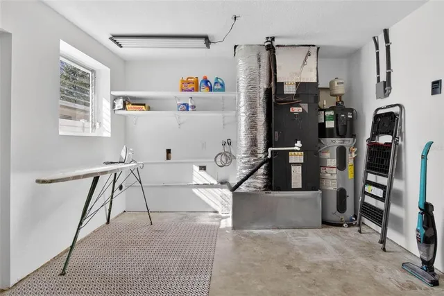 a view of house with backyard and outdoor seating