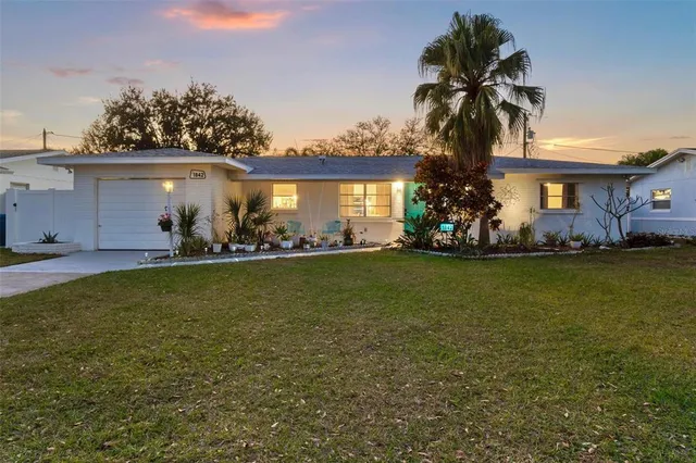 an aerial view of residential houses with city view