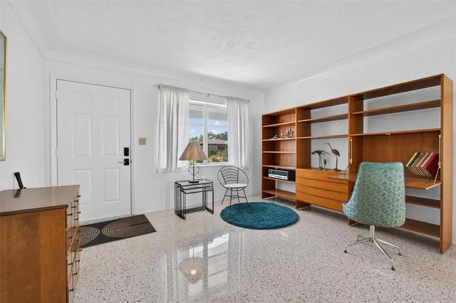 a view of a livingroom with furniture and wooden floor