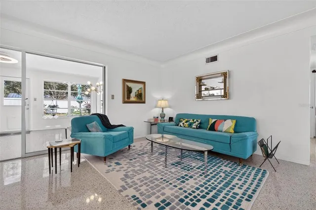 a living room with furniture and a window