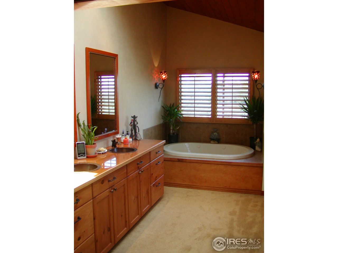 3262 Nebo Road Boulder, CO 80302 - Photo 11 of 24 a bathroom with a tub sink and mirror