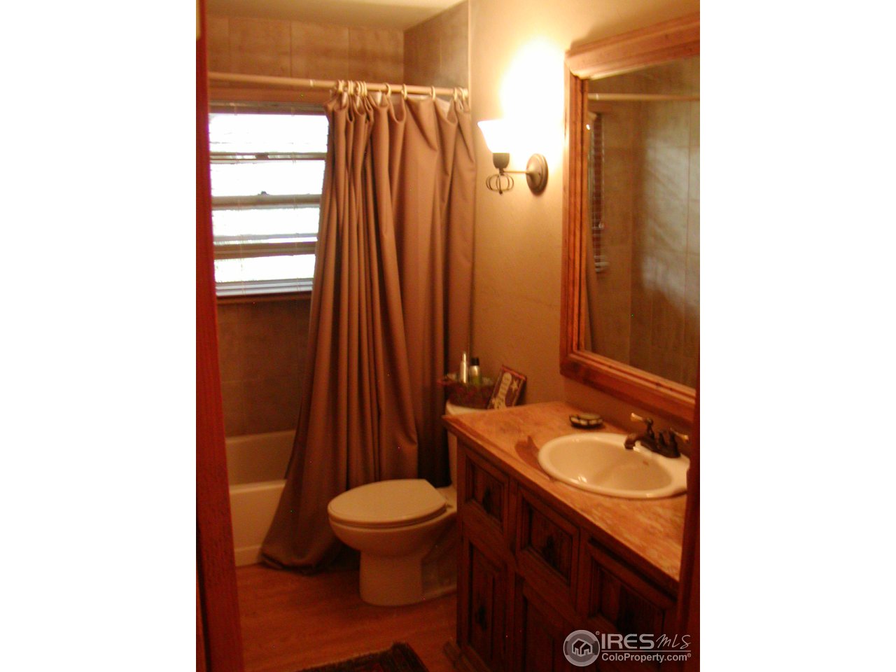 3262 Nebo Road Boulder, CO 80302 - Photo 14 of 24 a bathroom with a granite countertop sink toilet and mirror