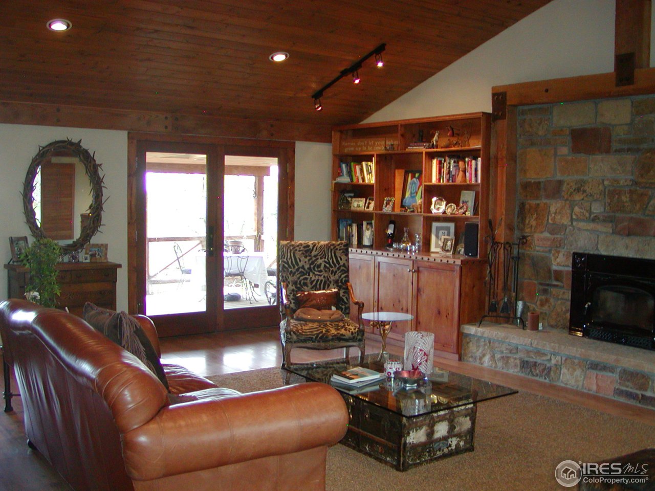 3262 Nebo Road Boulder, CO 80302 - Photo 2 of 24 a living room with furniture and a fireplace