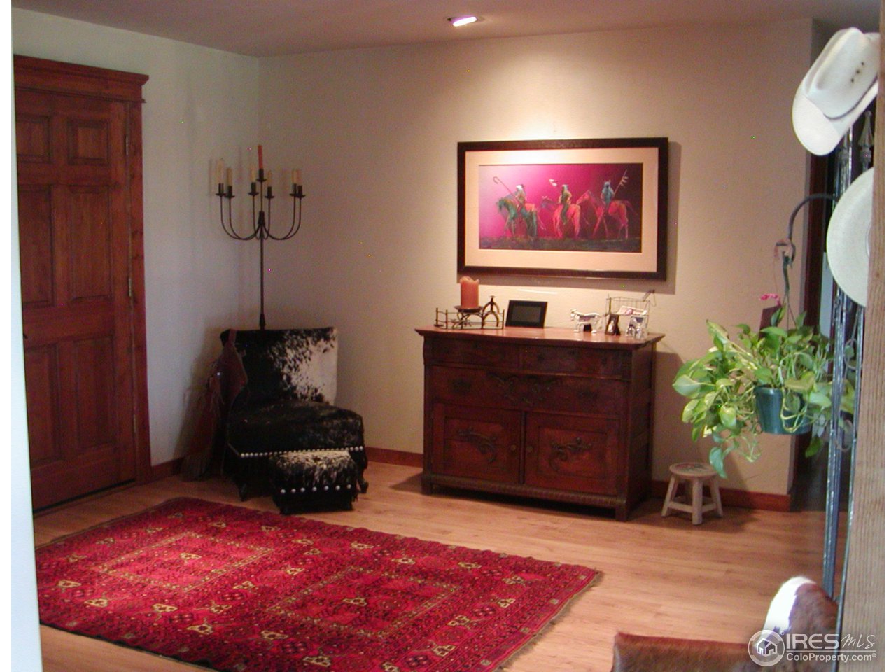 3262 Nebo Road Boulder, CO 80302 - Photo 22 of 24 a living room with furniture a chandelier and a rug