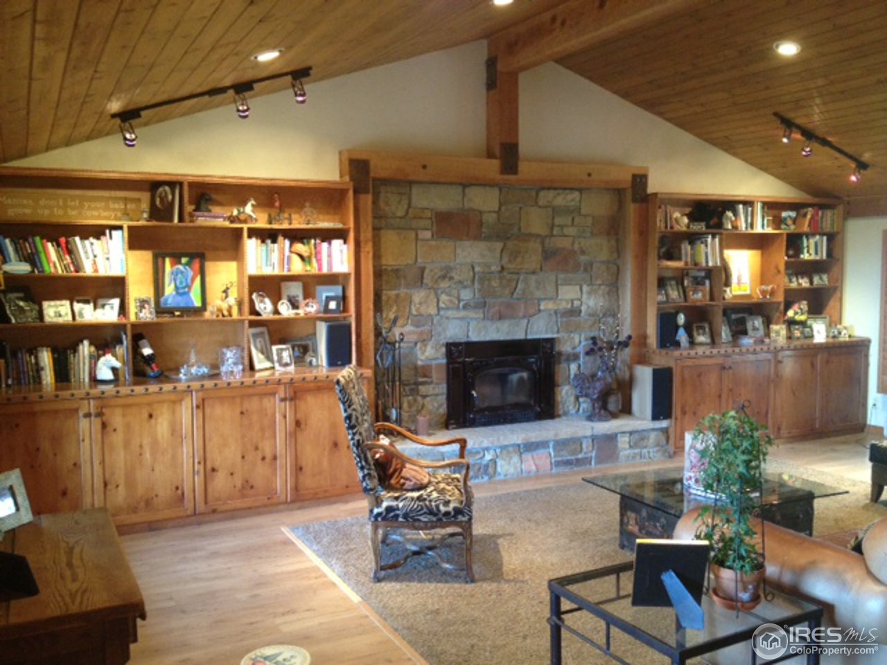 3262 Nebo Road Boulder, CO 80302 - Photo 24 of 24 a living room with furniture and a fireplace