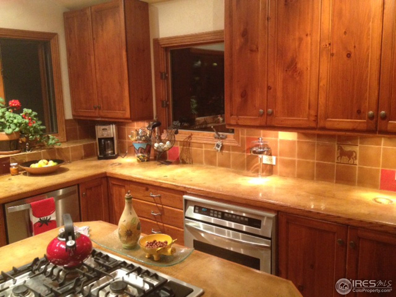 3262 Nebo Road Boulder, CO 80302 - Photo 6 of 24 a kitchen with a sink and a stove top oven