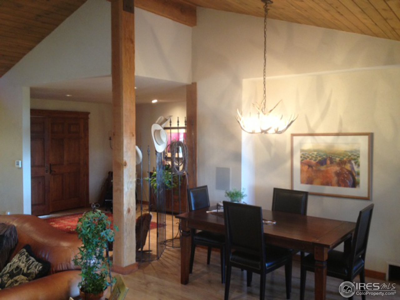 3262 Nebo Road Boulder, CO 80302 - Photo 8 of 24 a view of a dining room with furniture and wooden floor