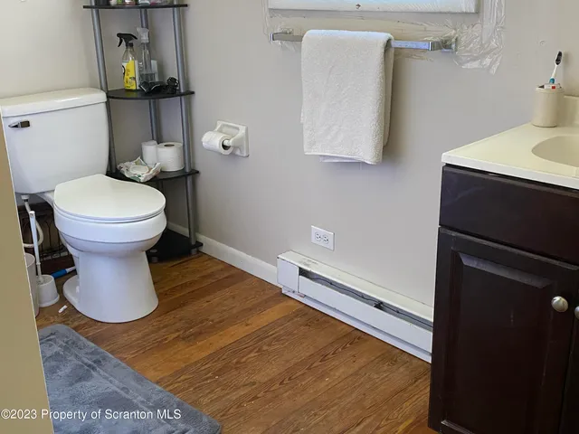 a bathroom with a sink vanity and a mirror