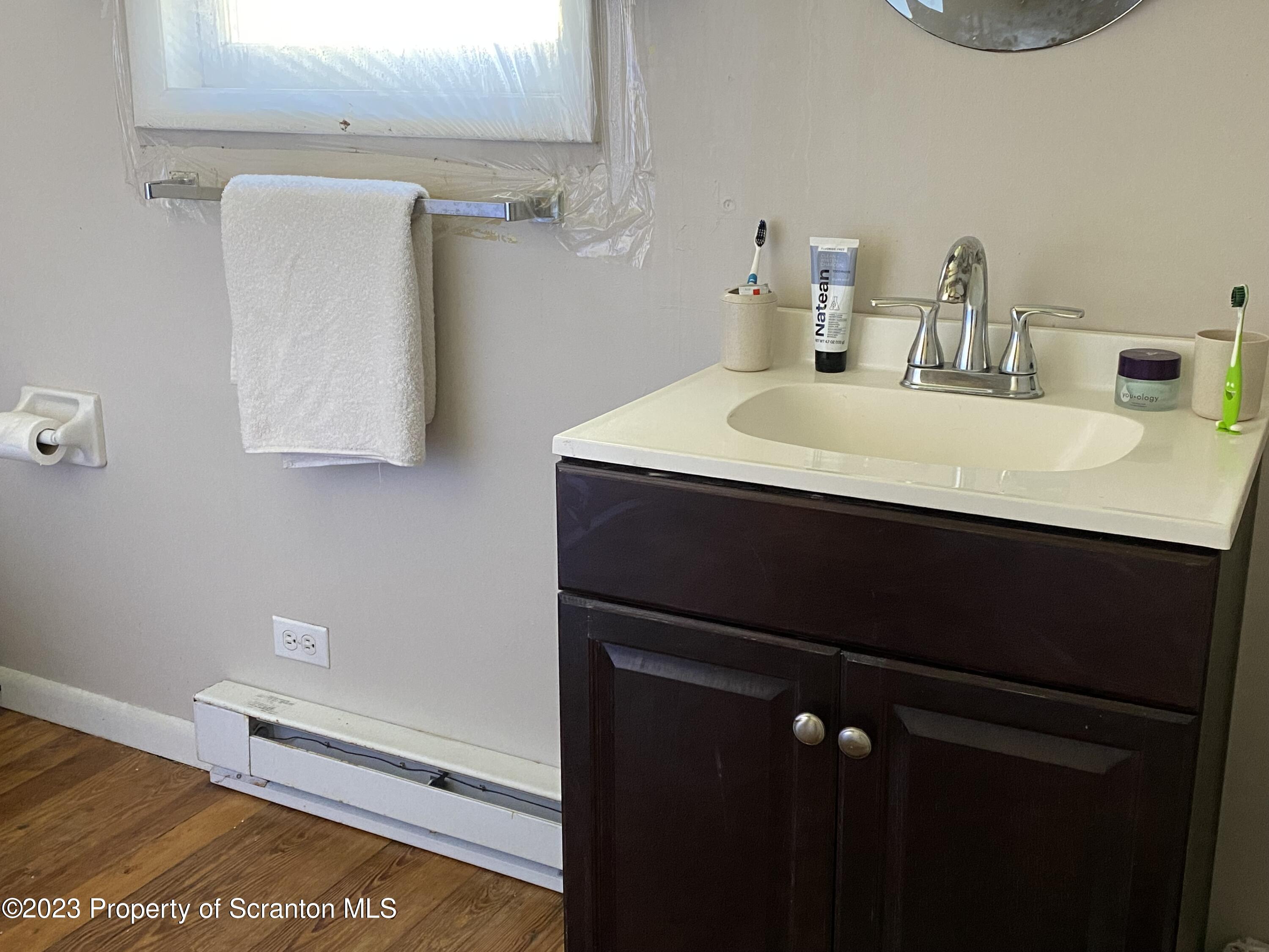 1058 Interchange Road Gilbert, PA 18331 - Photo 16 of 17 a bathroom with a sink vanity and a mirror
