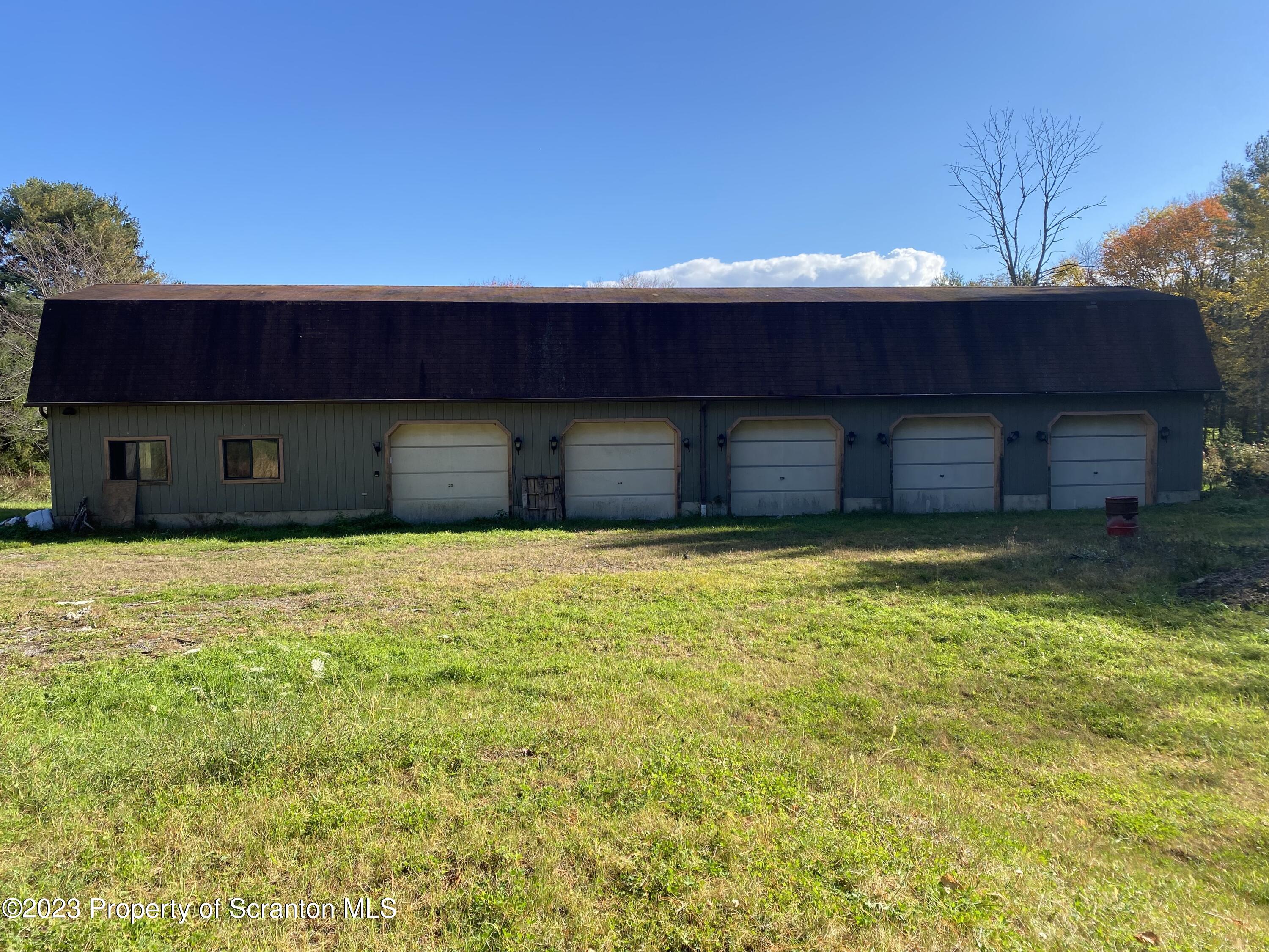 1058 Interchange Road Gilbert, PA 18331 - Photo 6 of 17 a house that has a big yard