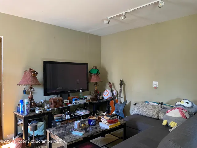 a room with furniture and a flat screen tv