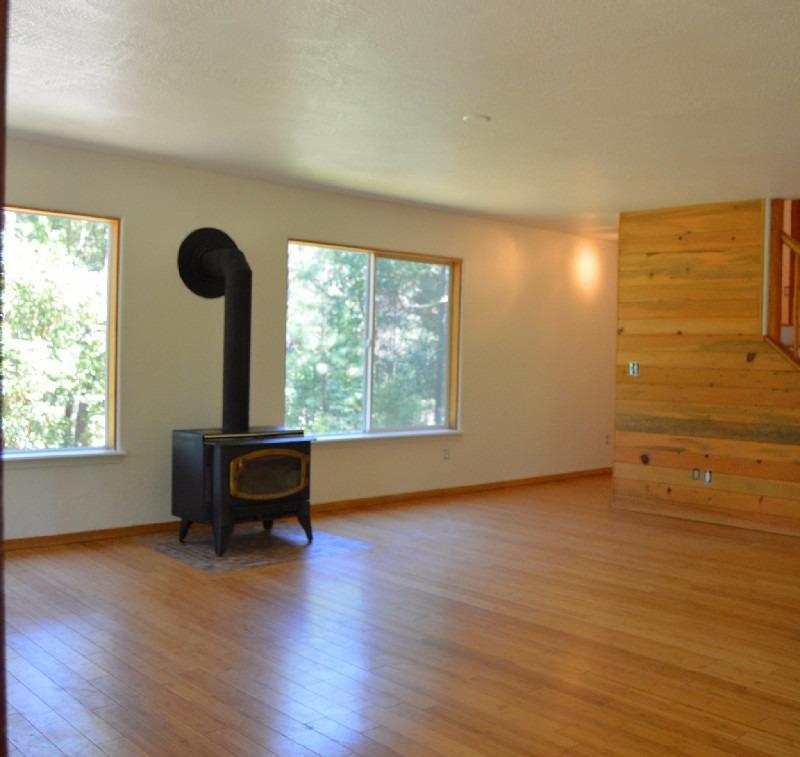 11825 Upper Applegate Road Jacksonville, OR 97530 - Photo 12 of 15 wooden floor in an empty room with a window