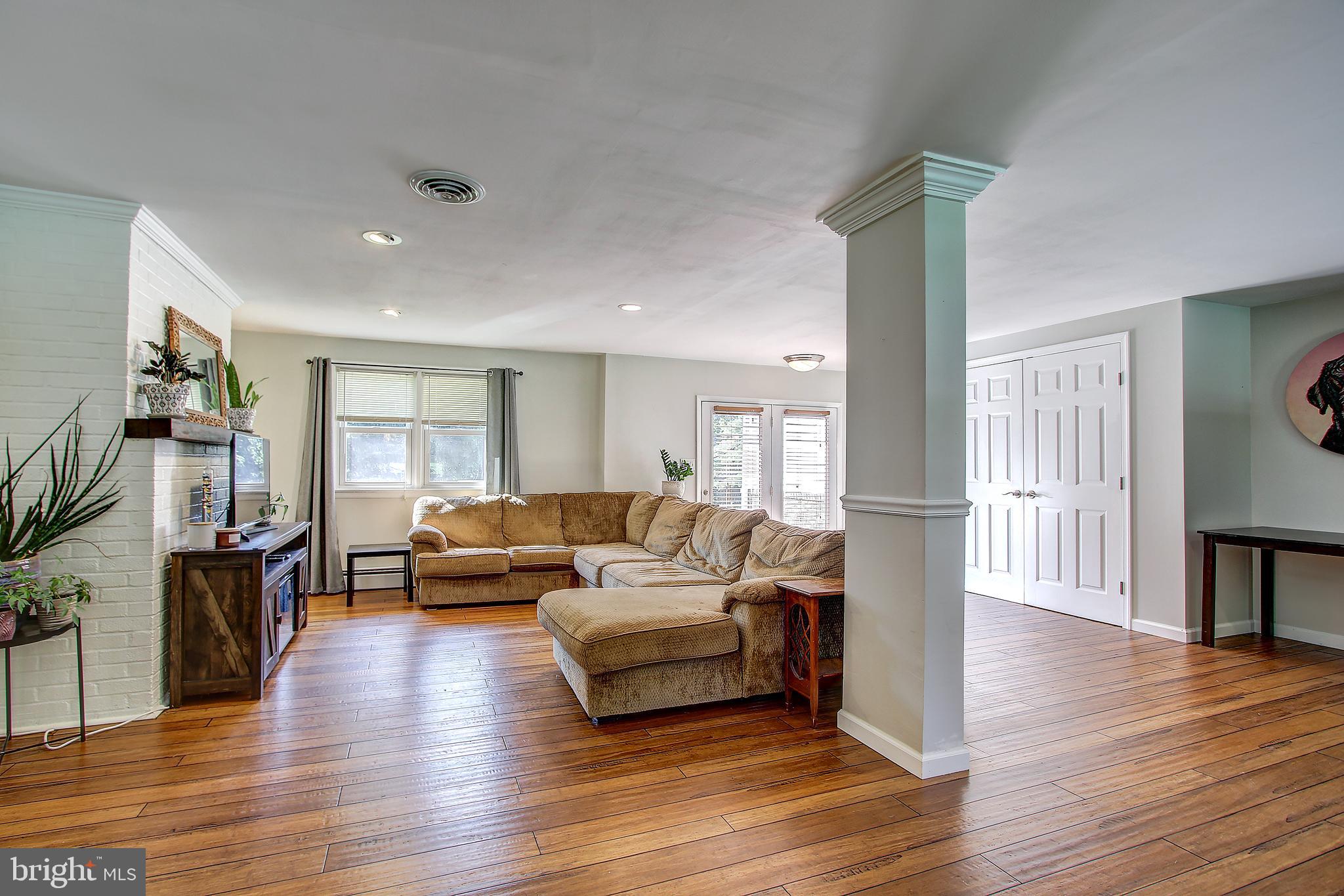 13846 Penn Shop Road Mount Airy, MD 21771 - Photo 4 of 42 a living room with furniture and a wooden floor