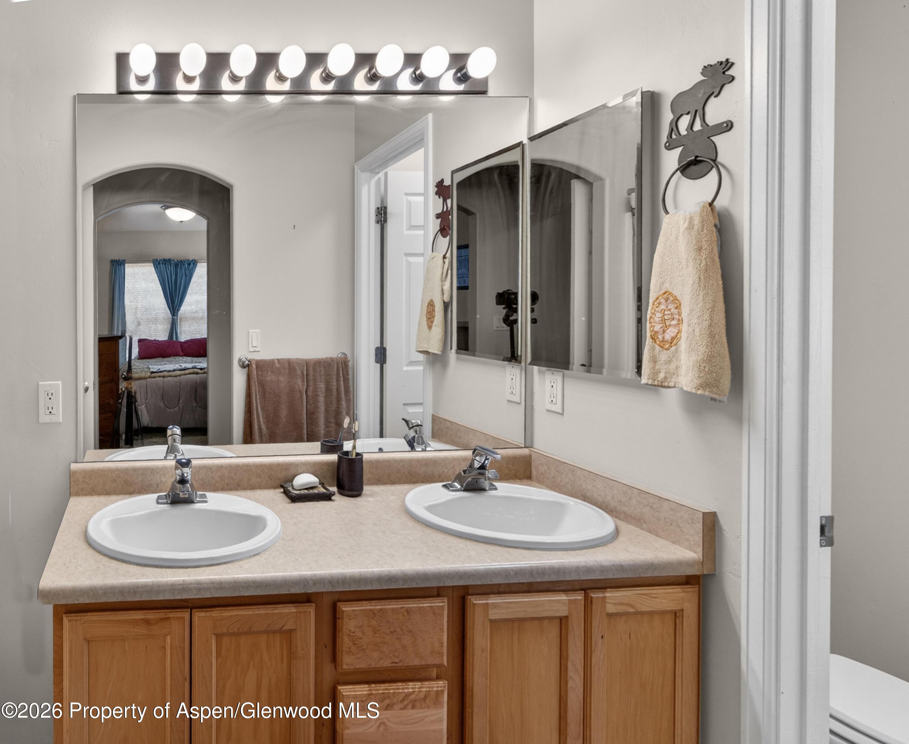 608 Lariat Loop New Castle, CO 81647 - Photo 18 of 32 a bathroom with a sink double vanity and a mirror