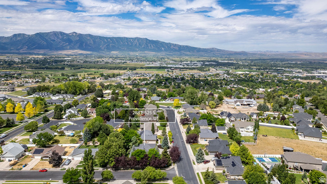 288 525 South Providence, UT 84332 - Photo 69 of 71 Expansive aerial perspective showcasing a residential neighborhood with established homes and mature landscaping