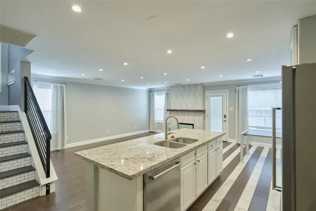 a kitchen with a sink and a refrigerator